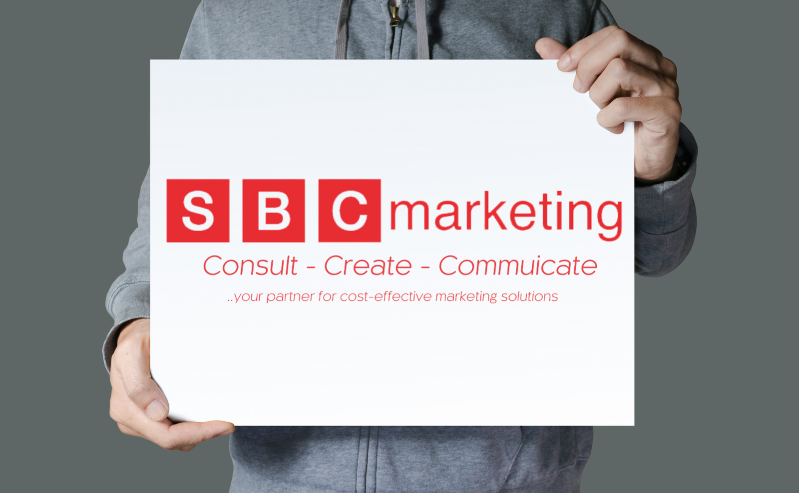Man holding SBC Marketing London Full Logo - logo colours red and white