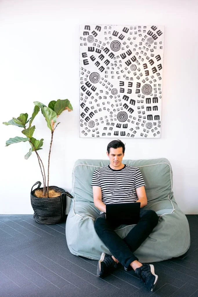 SBC Digital Marketing Agency London team member -sitting-cozy-while-working-on-his-laptop
